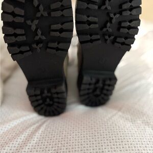 Black Combat Boots with Rugged Soles and Durable Design